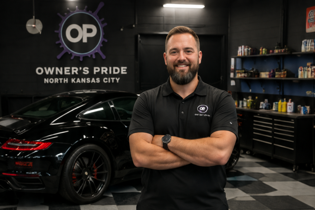 Owner's Pride North Kansas City technician with vehicle and detailing products in shop